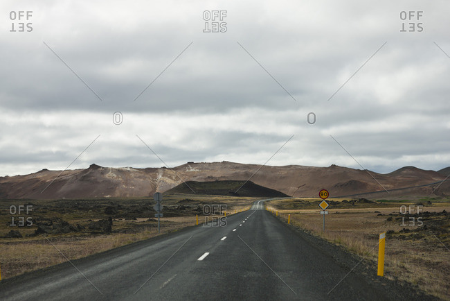 Road winding through barren landscape, Iceland