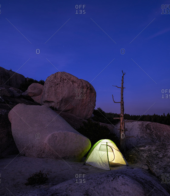 9/6/15: Tent on a barren, rocky landscape surrounded by granite boulders at night