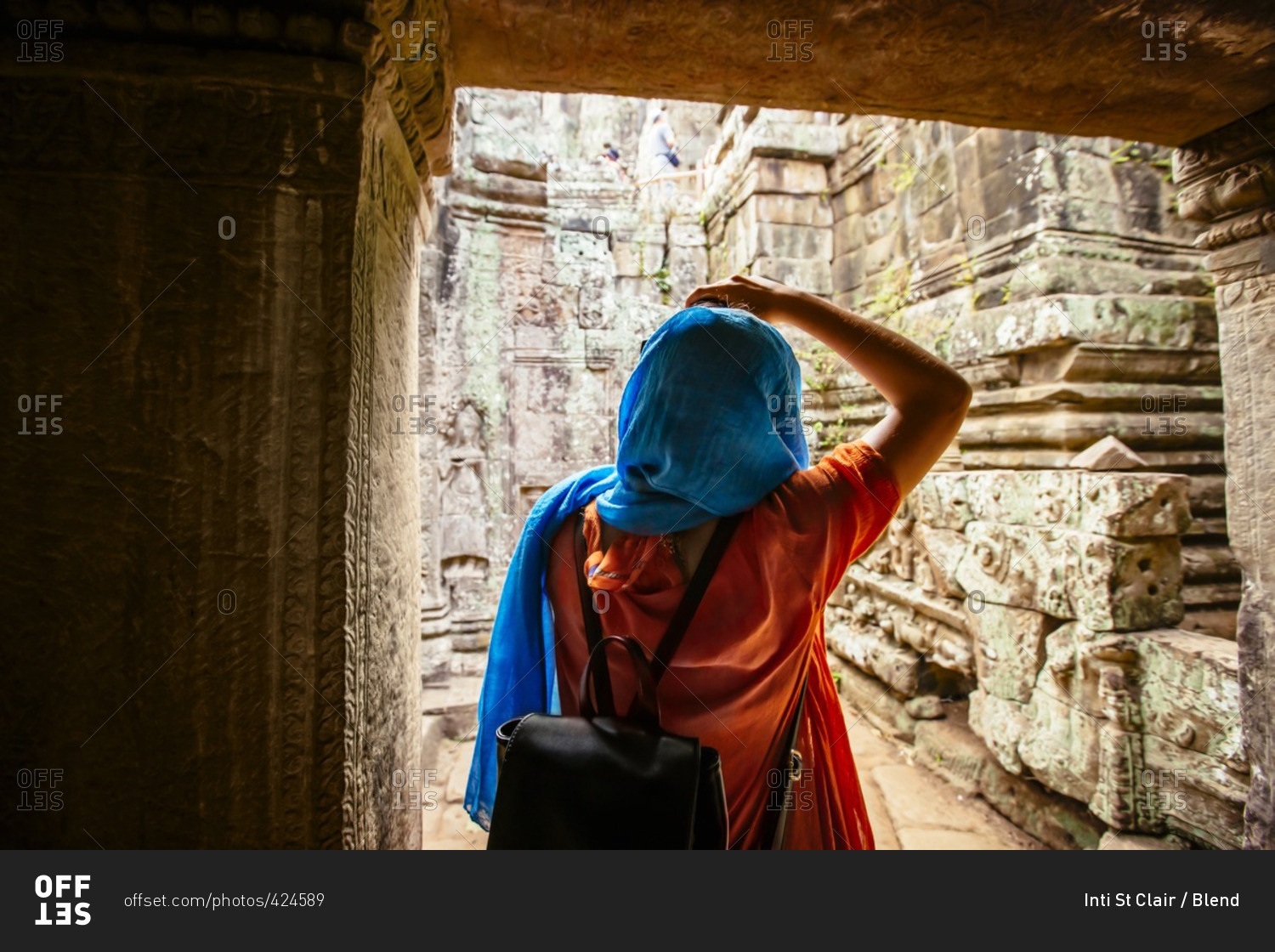 Woman exploring ruins at Angkor Wat, Siem Reap, Cambodia