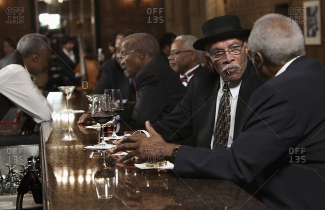 African American men drinking at bar