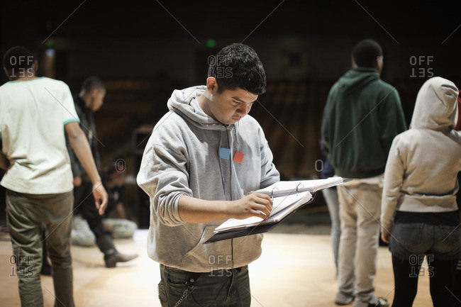 Teenagers rehearsing on stage