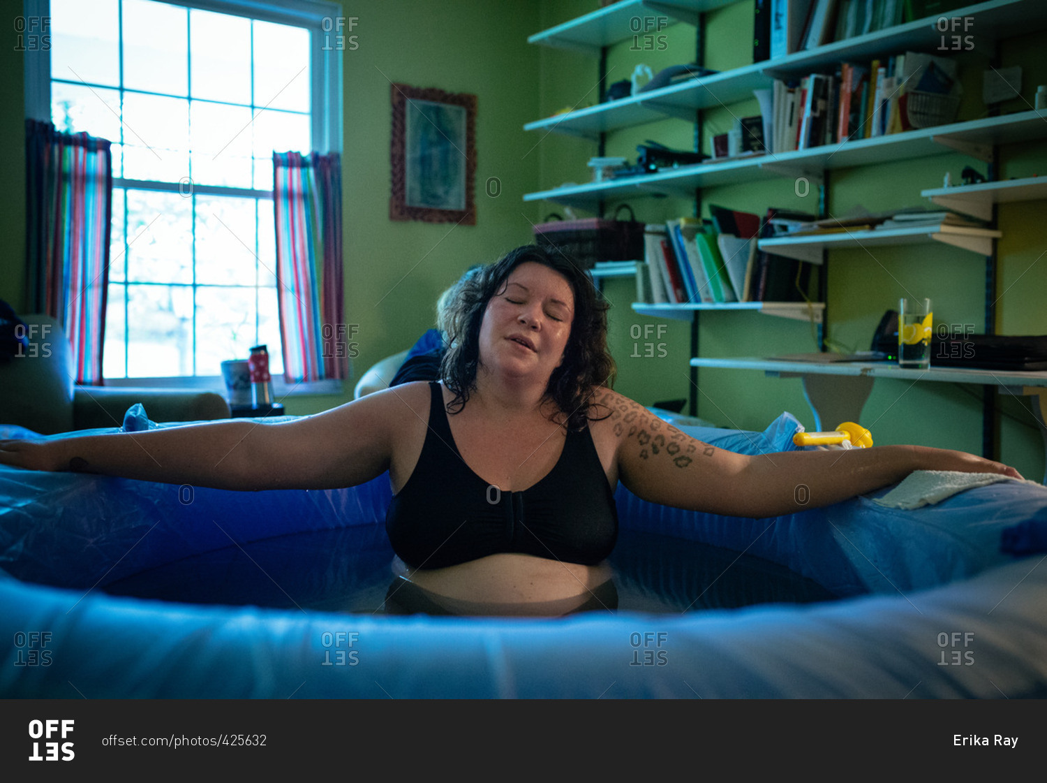 Woman in a tub during a home birth