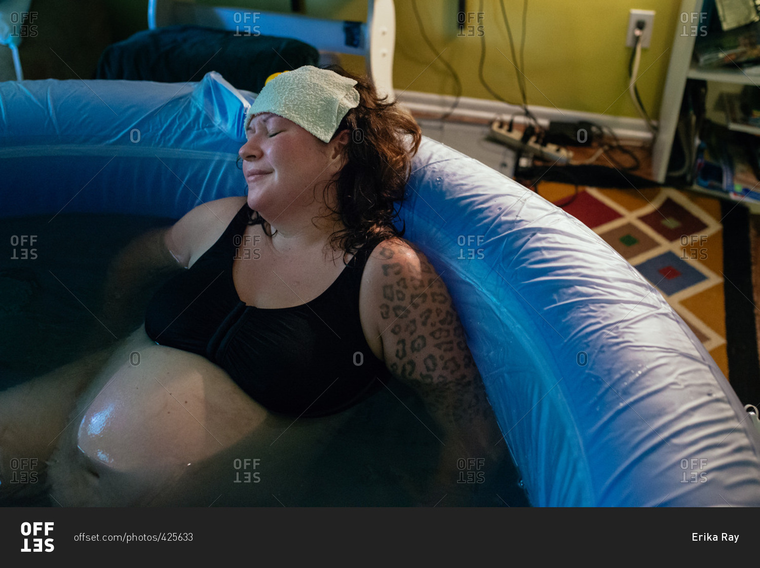 Woman in a tub during a home delivery