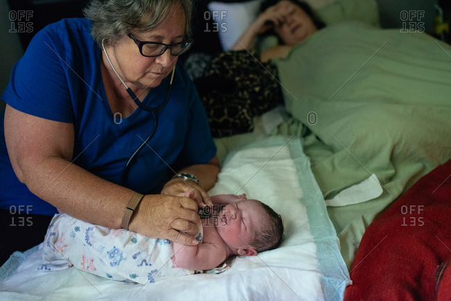 Woman checking baby after birth