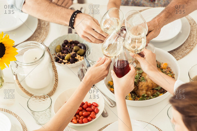 Cropped view of friends making a toast