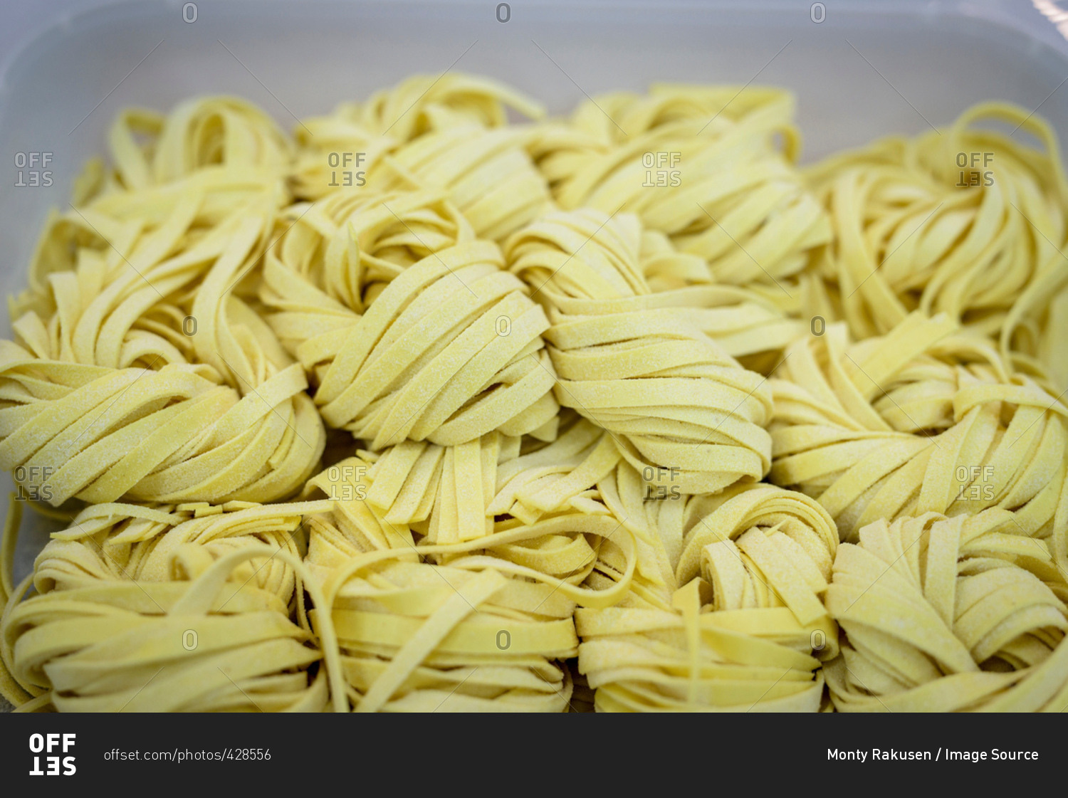 Detail of tagliatelle pasta in pasta factory