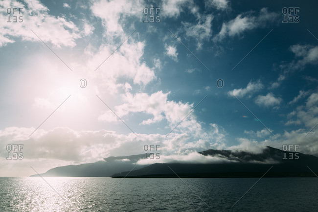 A mountainous view from a sailboat along the coast of Cairns, Australia