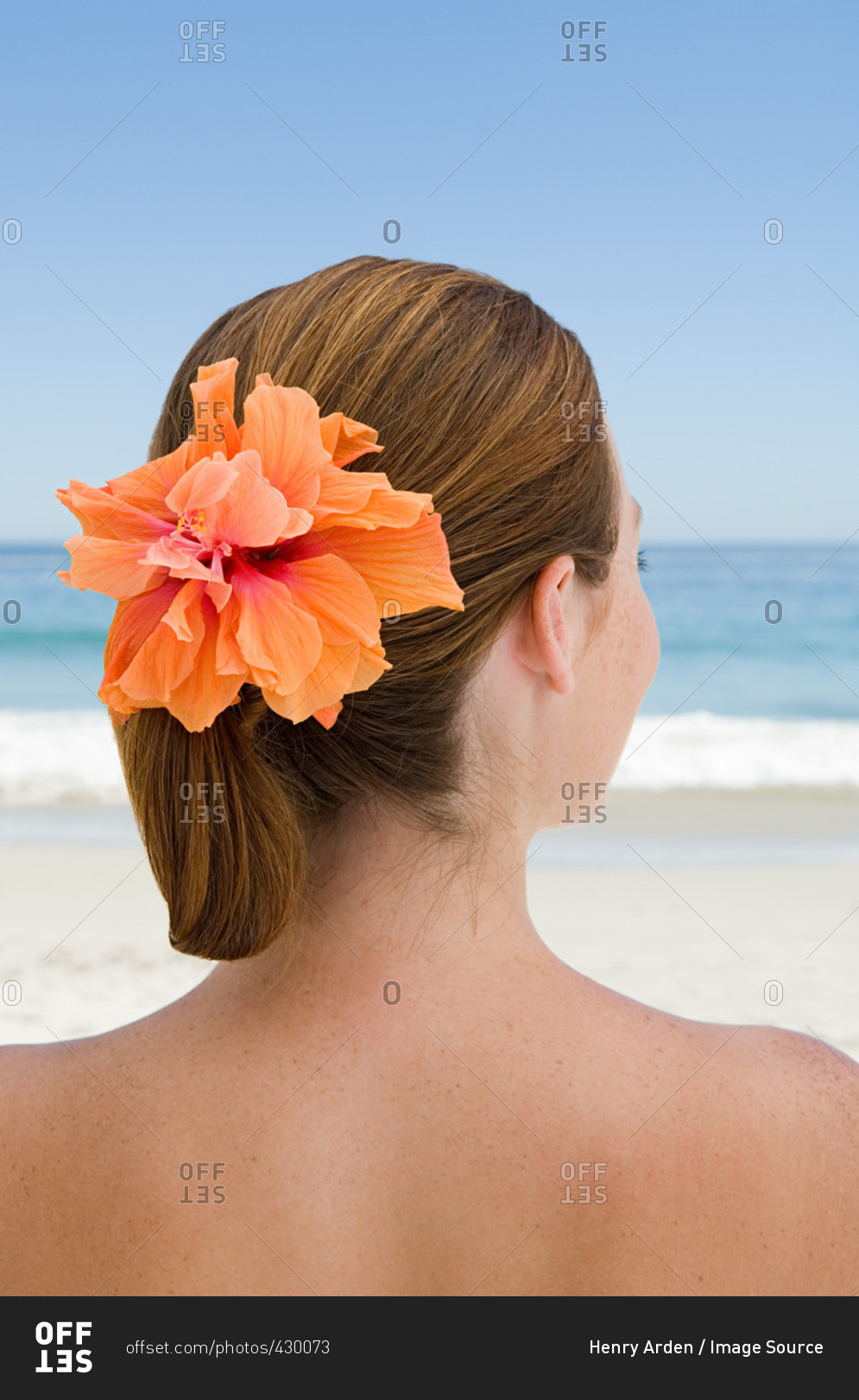 Young woman with flower in her hair