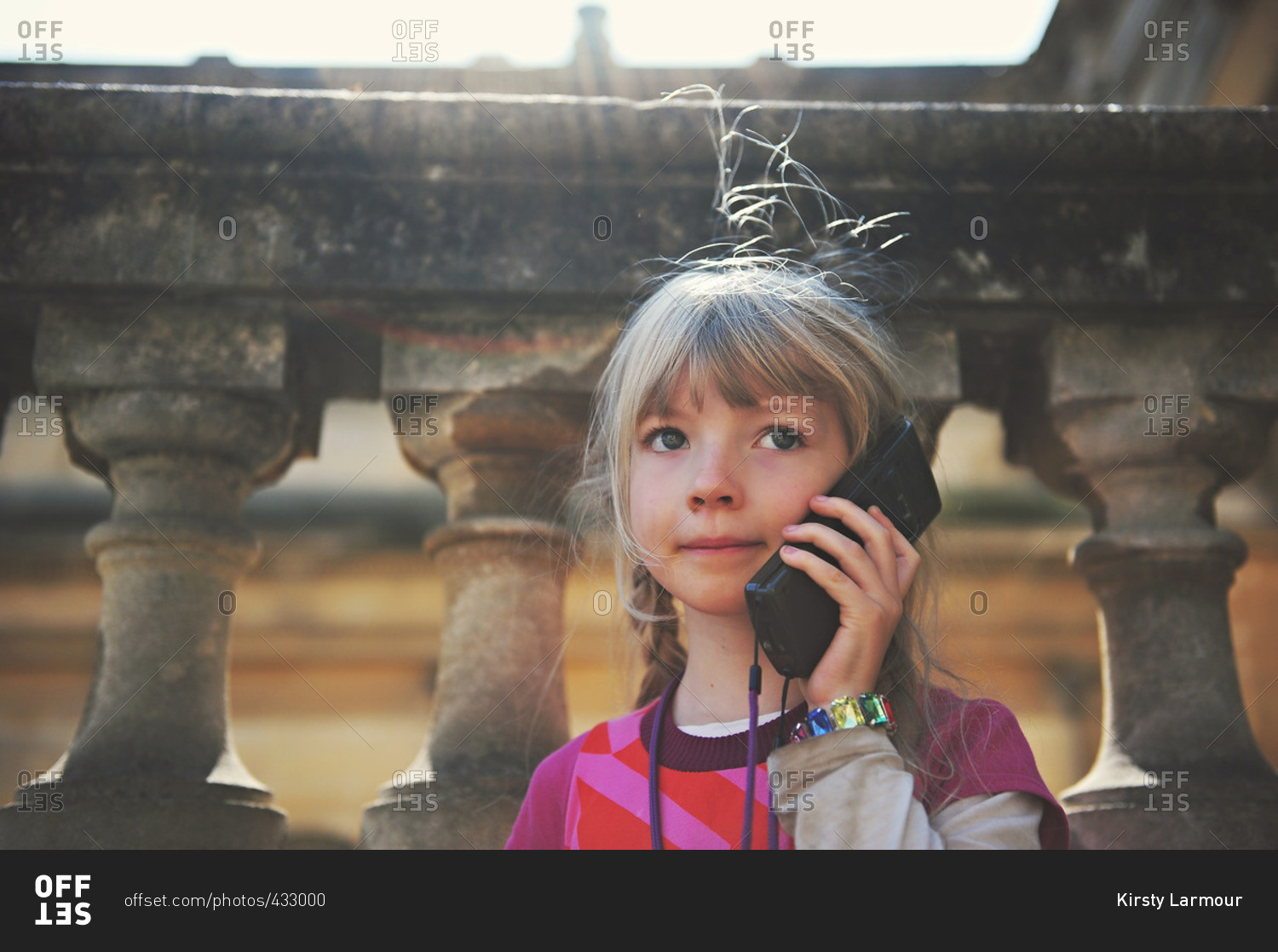 A child listens to an audio guide