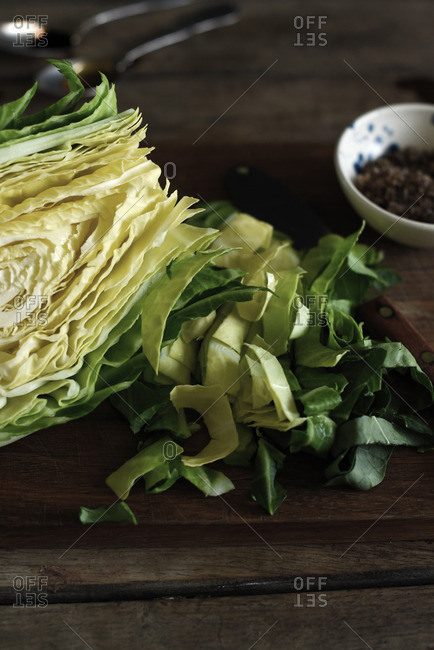Cabbage head being sliced - Offset