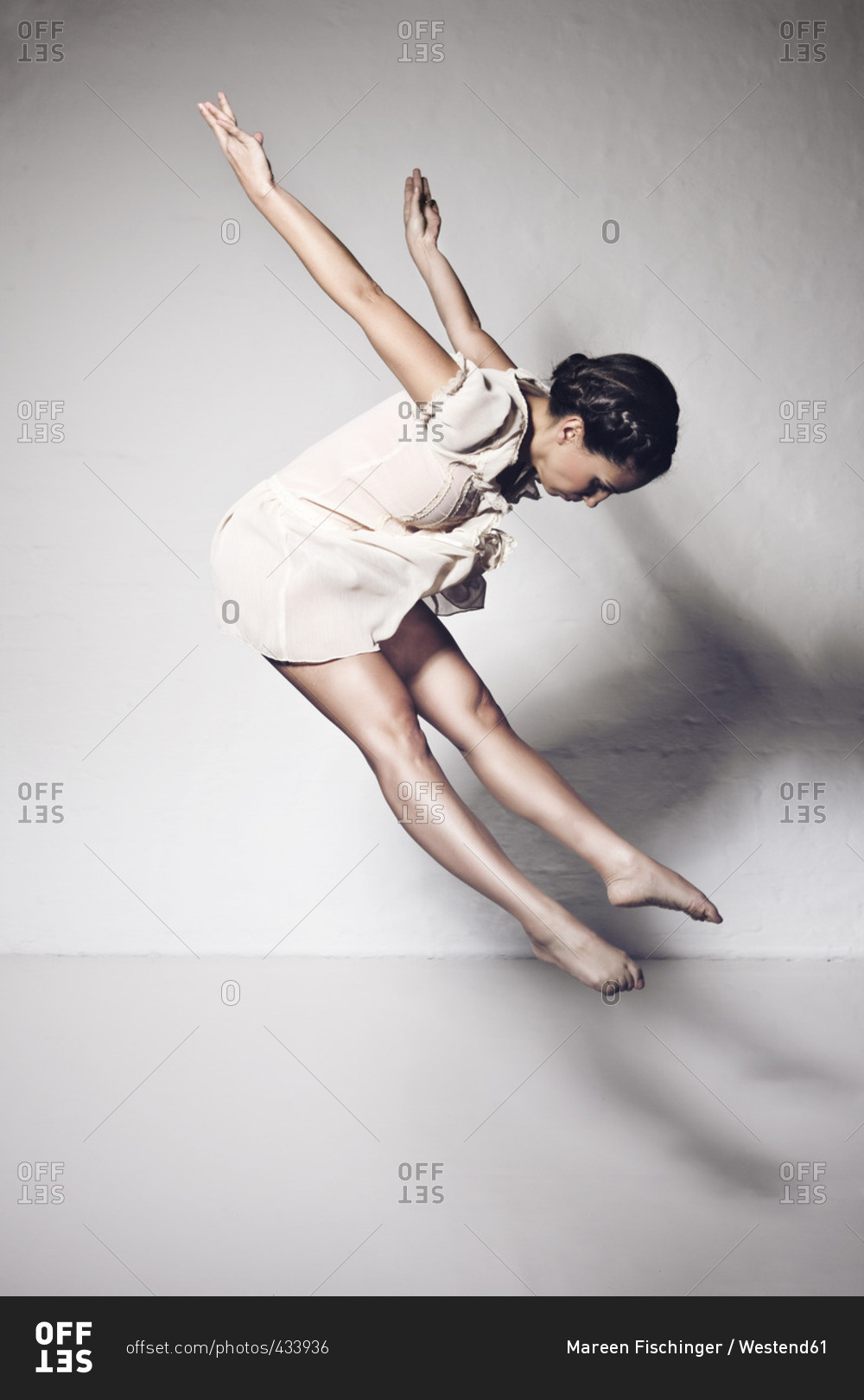 Dancer jumping in studio