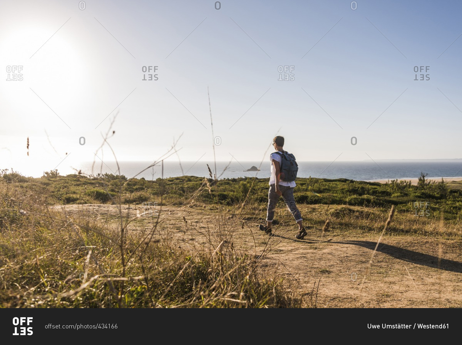 France, Bretagne, Finistere, Crozon peninsula, woman during beach hiking