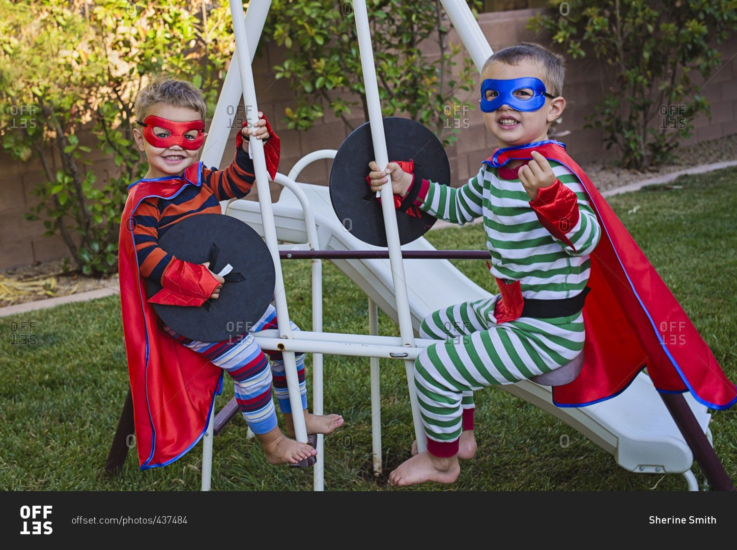 Two boys in superhero costumes