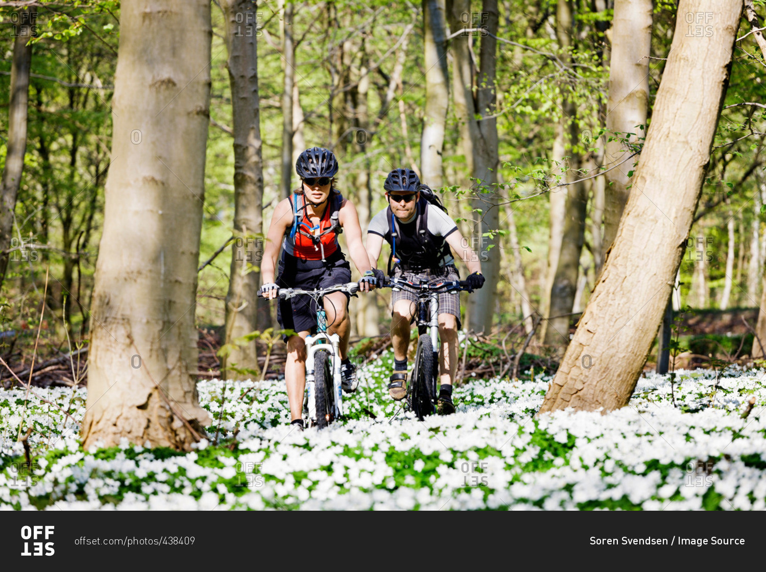 Couple mountain biking together