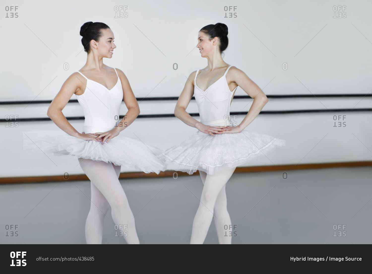 Ballet dancers posing together in studio