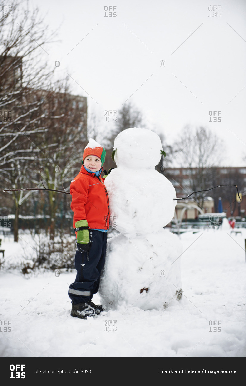 building a snowman stock photos - OFFSET