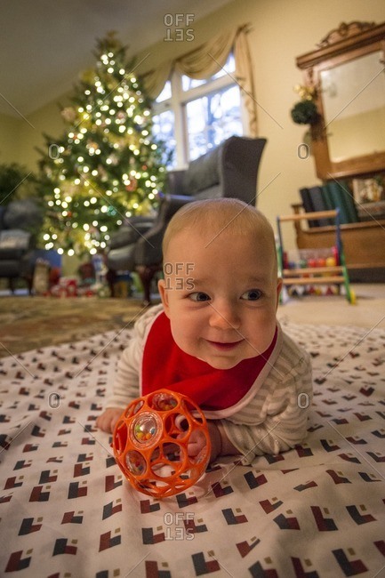 Baby on a blanket at Christmastime