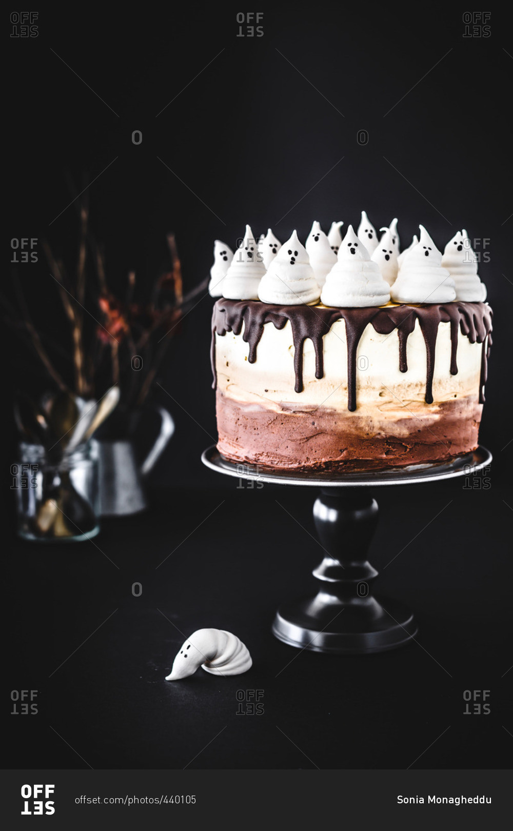 Spooky ombre Halloween cake with fluffy ghosts on top