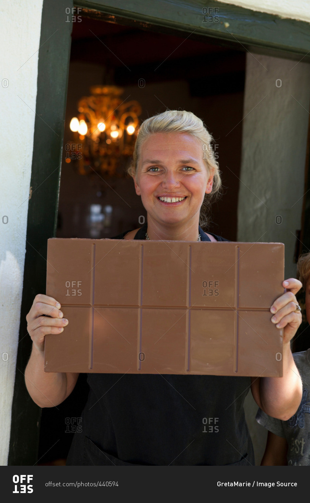 Woman showing chocolate bar
