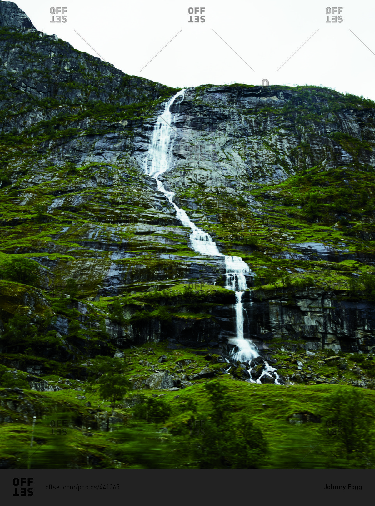 Waterfall along a mossy mountainside