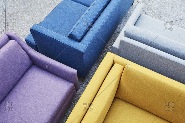 Close-up of sofas of different colors