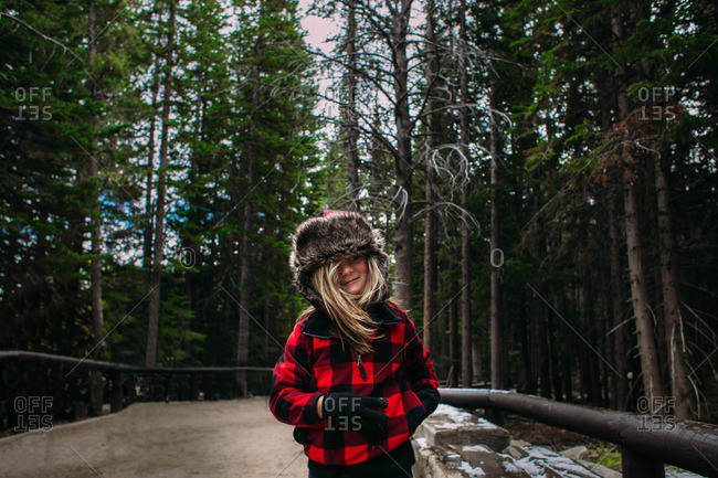 Boy in fur hat smiling