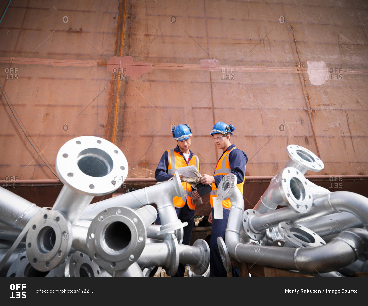 Engineers inspecting ship parts