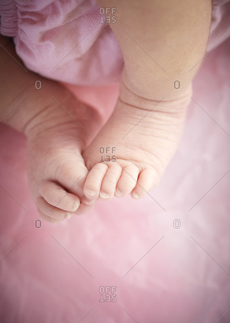 Newborn baby girl's bare feet