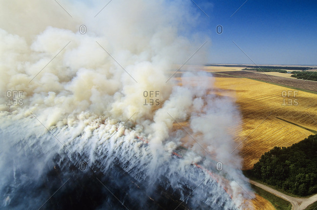 Aerial of residual crop burning in Manitoba, Canada.