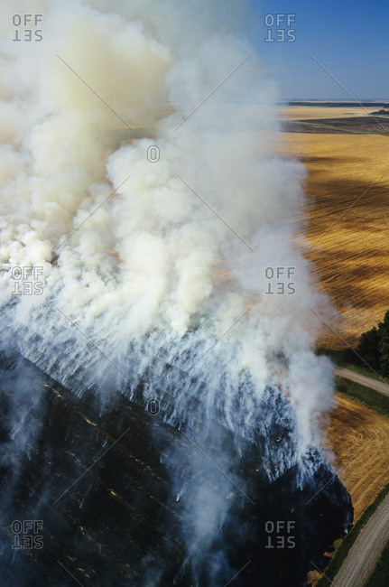 Aerial of residual crop burning in Manitoba, Canada.