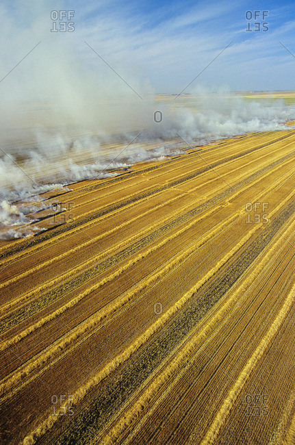 Aerial of residual crop burning in Manitoba, Canada.