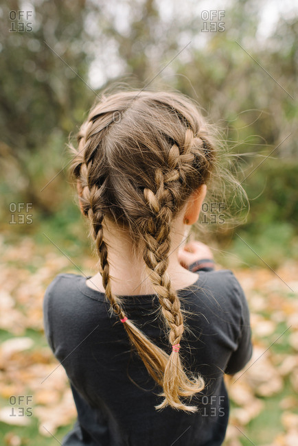 Girl With Braided Hair Standing Outside On An Autumn Day
