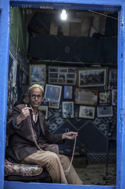Essaouira, Morocco, Africa - January 3, 2016: Tailor steaming along in his shop
