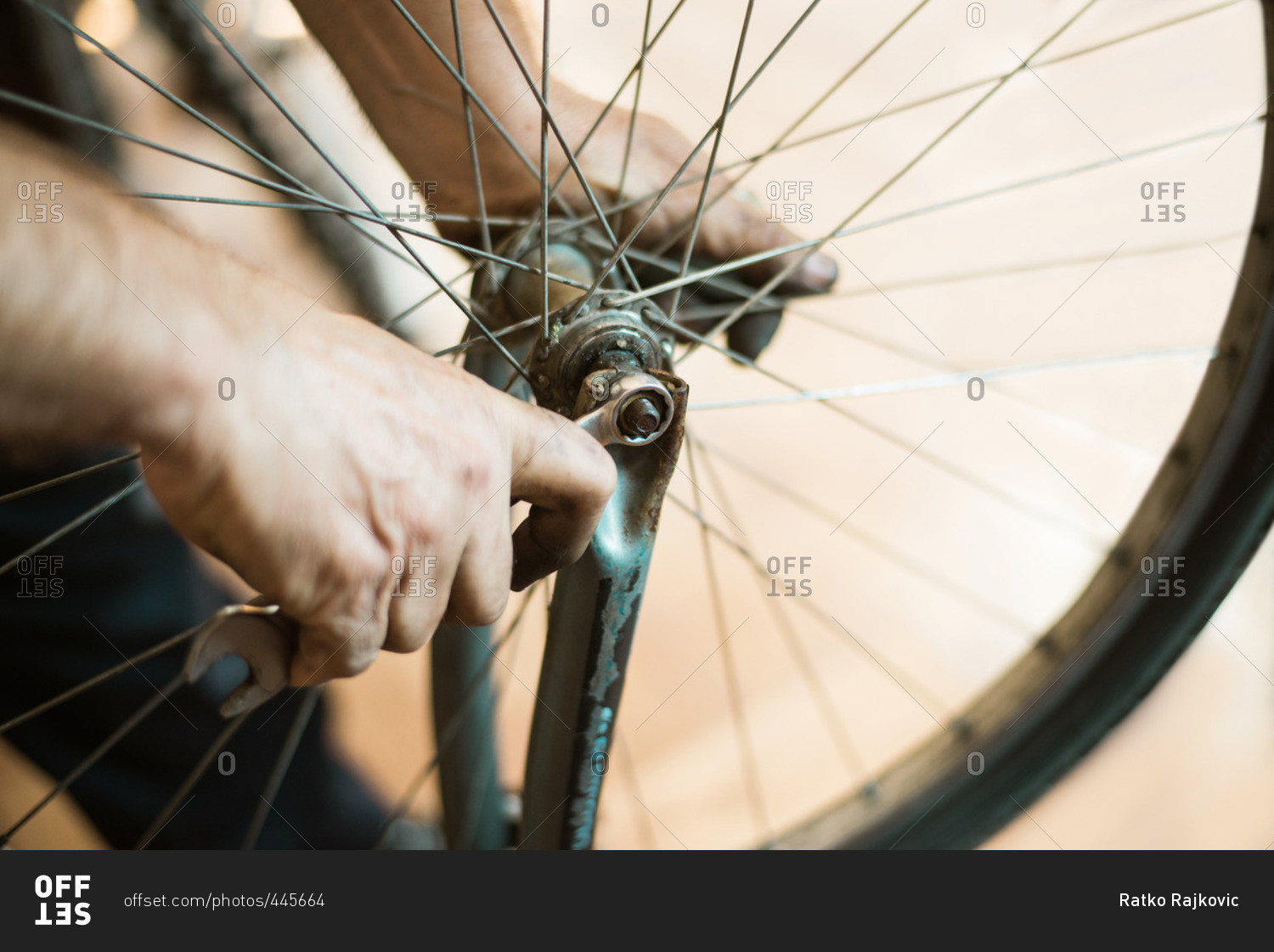 Man removing bike tire from a bike frame