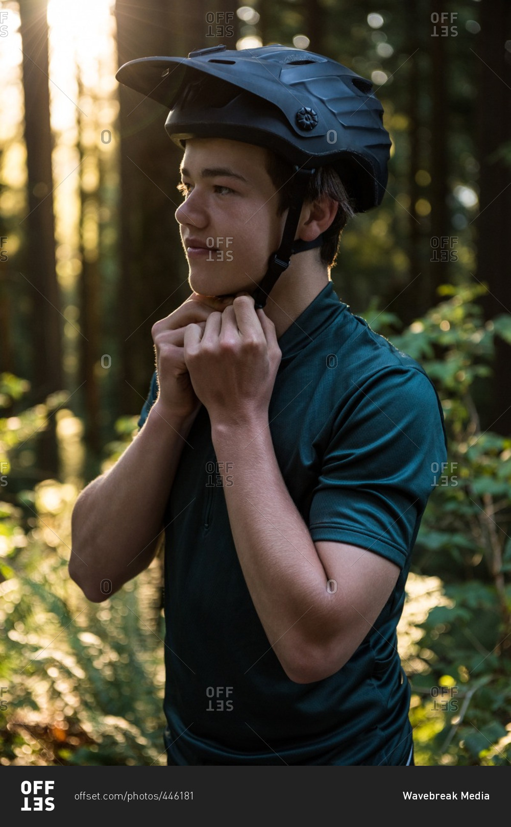 Male athletic wearing bicycle helmet in countryside
