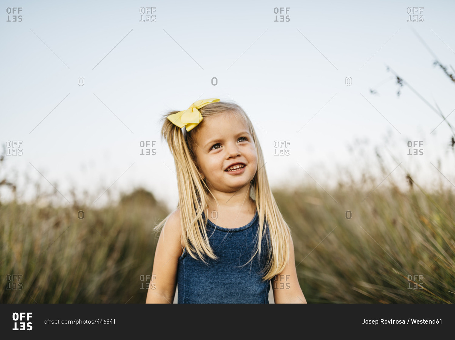 Portrait of smiling little girl with hair ribbon