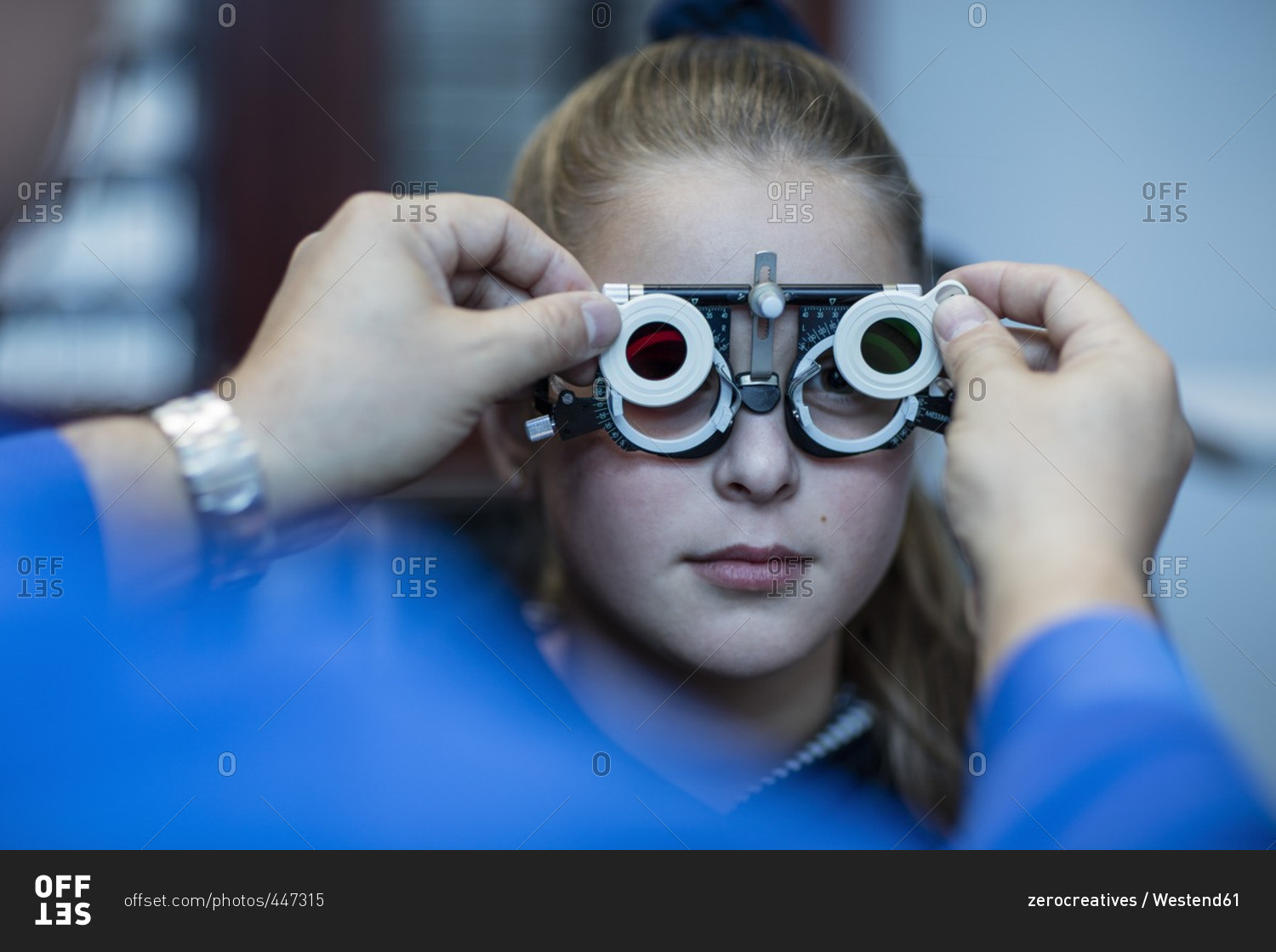 Girl doing eye test at optometrist