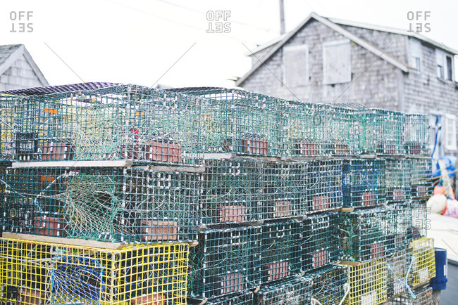 Stack of lobster cages on coast
