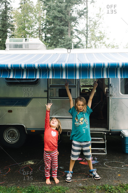 Kids underneath a camper awning