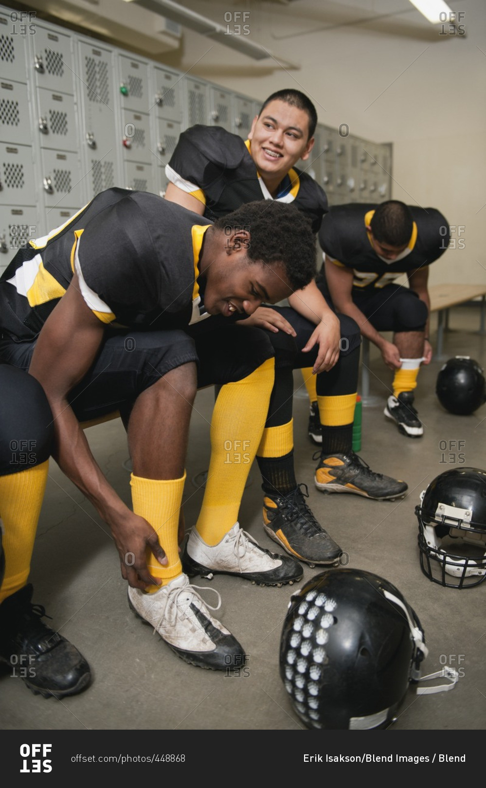 Football players dressing in locker room