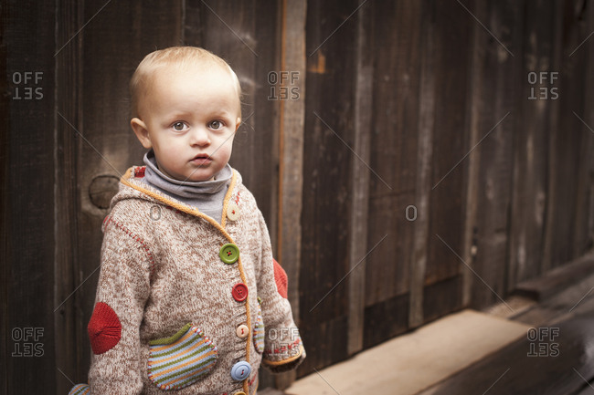 Caucasian boy standing outdoors - Offset