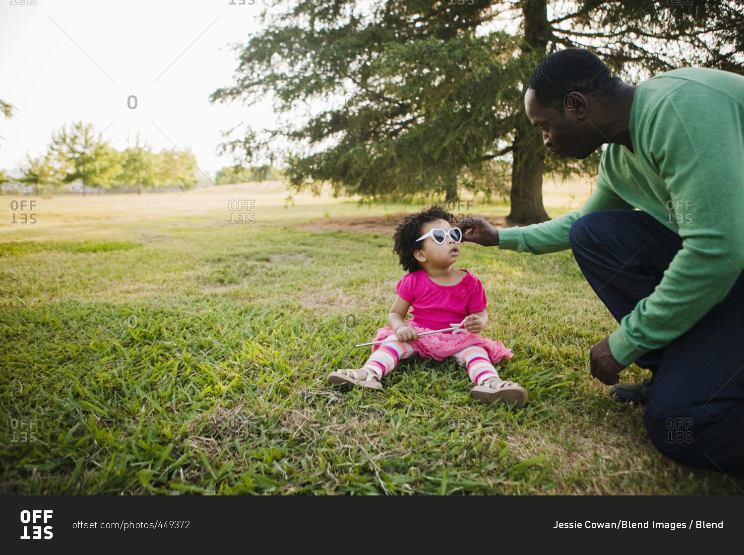 Black father and daughter enjoying the park