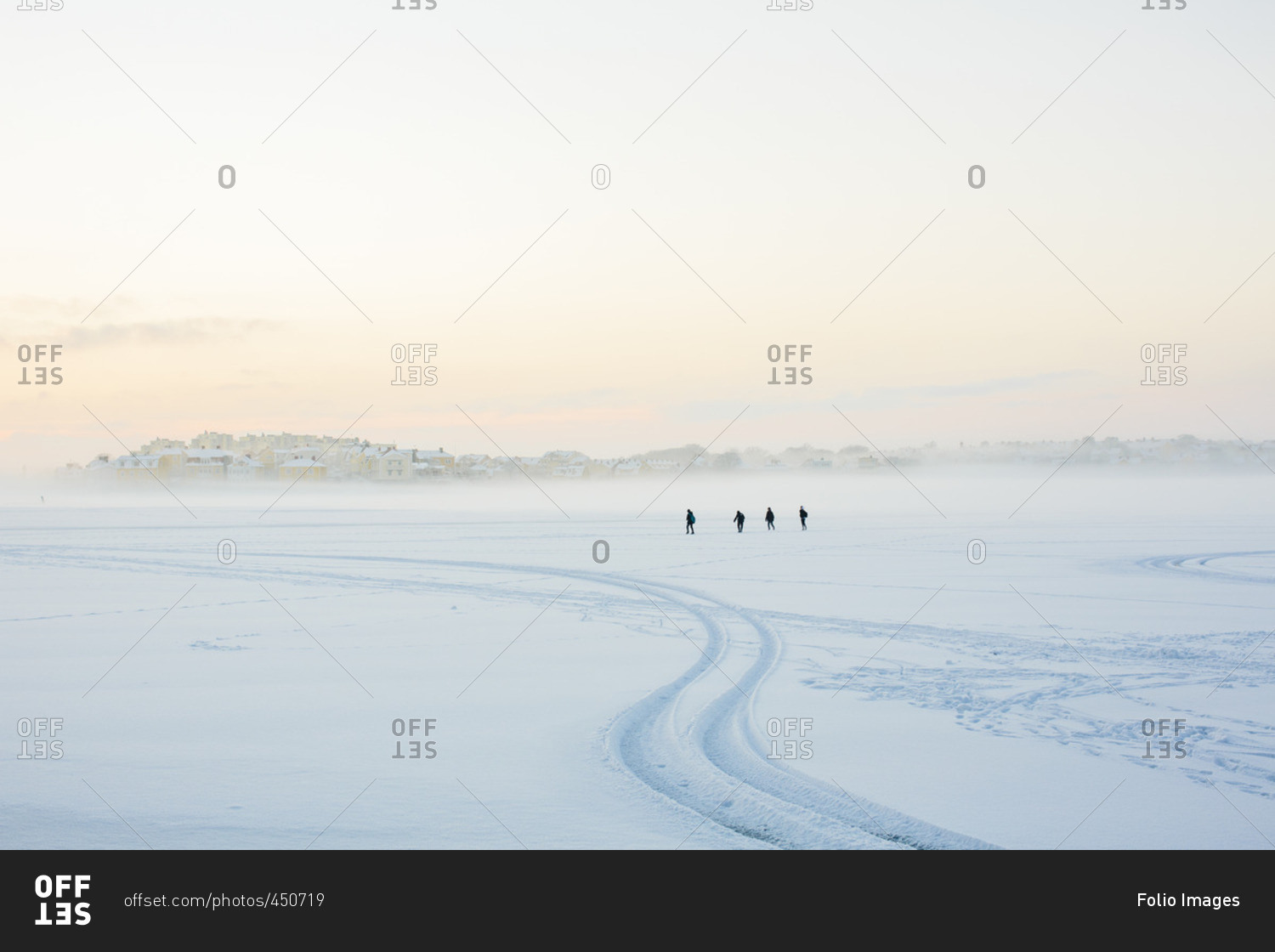 Sweden, Blekinge, Karlskrona, Borgmastarefjarden, Snowy landscape with people walking in distance