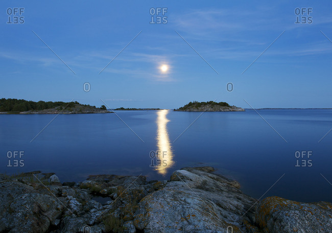 Finland, Eckero, Berghamn, Moonlight over Aland Archipelago stock photo -  OFFSET