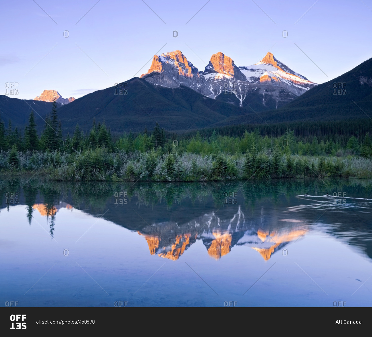 Three Sisters Mountain reflection in water, Canmore, Alberta, Canada