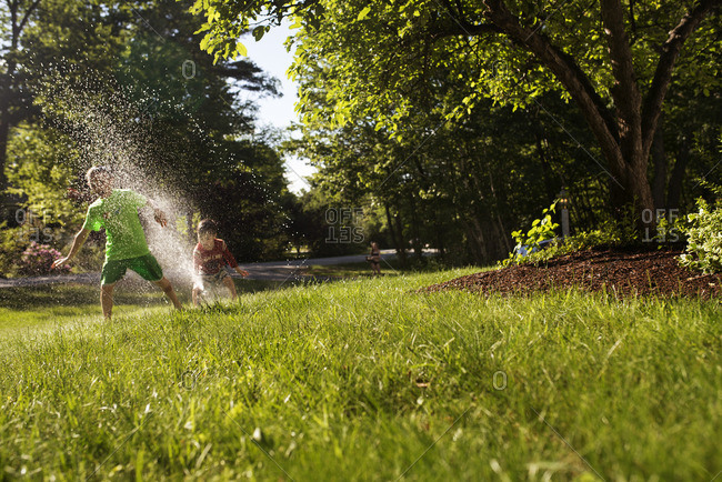 Children playing in a sprinkler