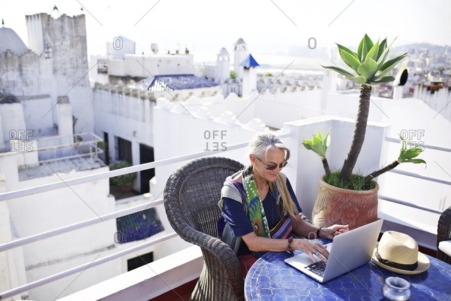 Senior woman using laptop on table