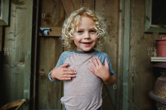 Smiling Boy With Blonde Curly Hair Stock Photo Offset