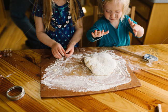 Girls preparing biscuit dough
