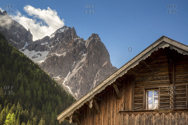 Wooden house in Fiscalina valley with Cima Undici on background, Bolzano district, South Tyrol